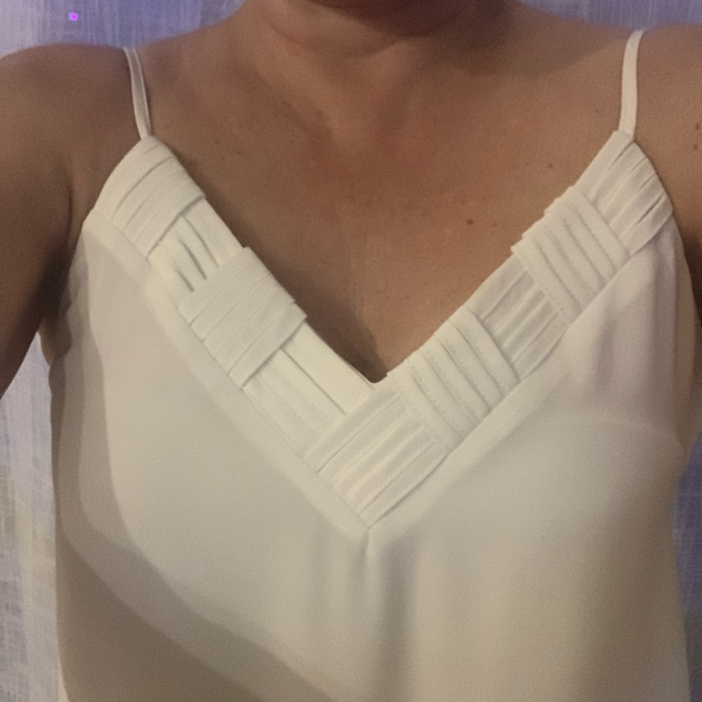 Ivory shell with nice detailing at neckline